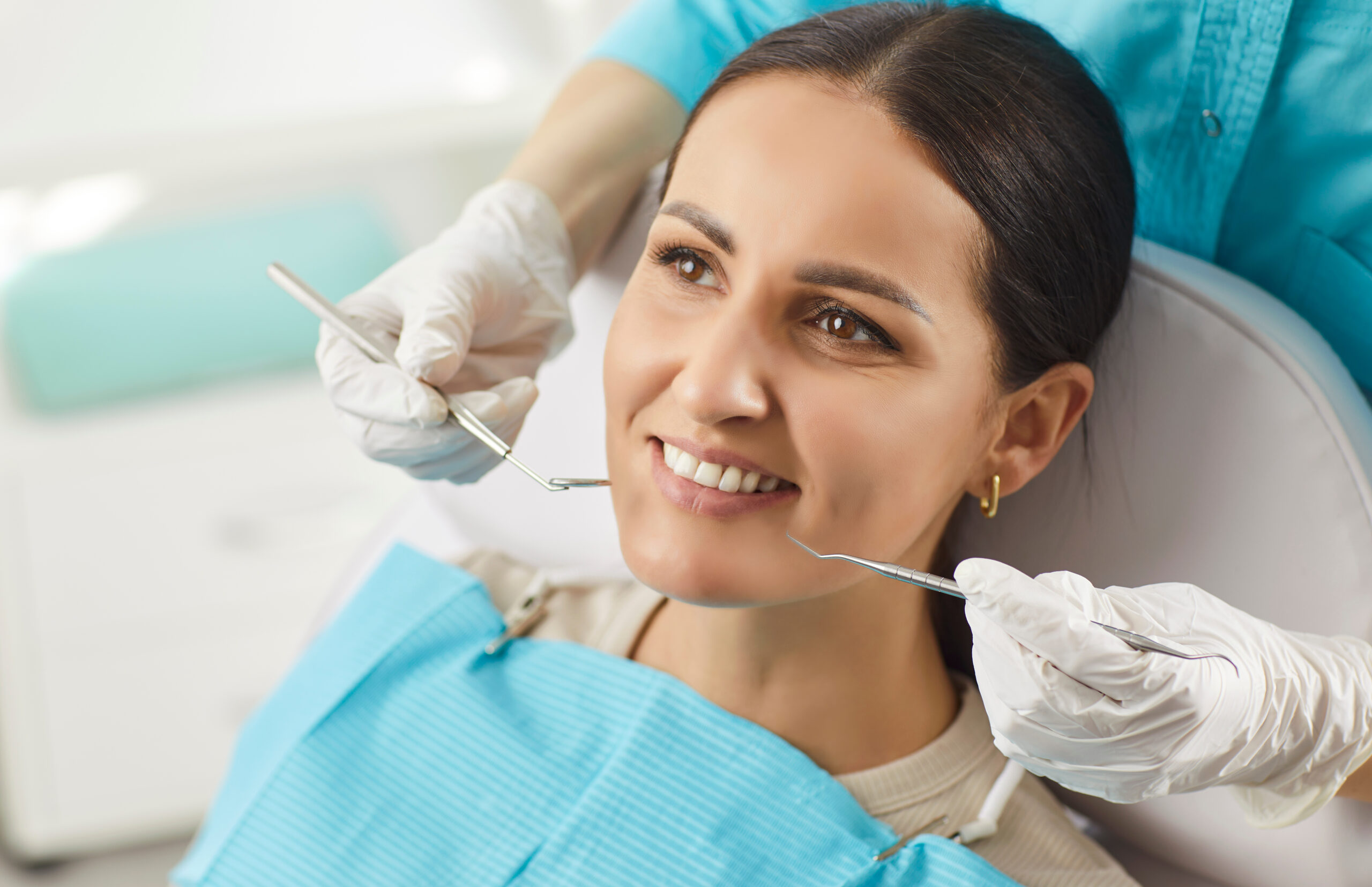 Stomatology clinic, perfect white toothy smile, whitening treatment procedure result in health dentistry service, oralcare, dentist doctor working with happy female patient in medical dental chair