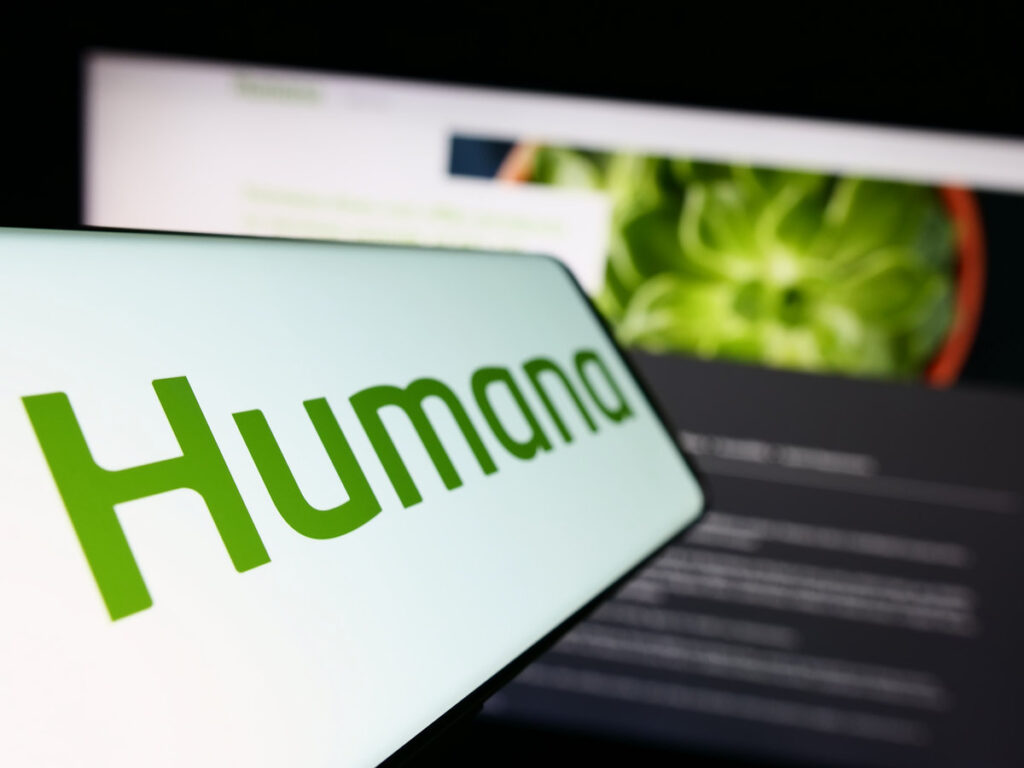 Stuttgart, Germany - 07-28-2023: Cellphone with logo of American health insurance company Humana Inc. on screen in front of business website. Focus on left of phone display.
