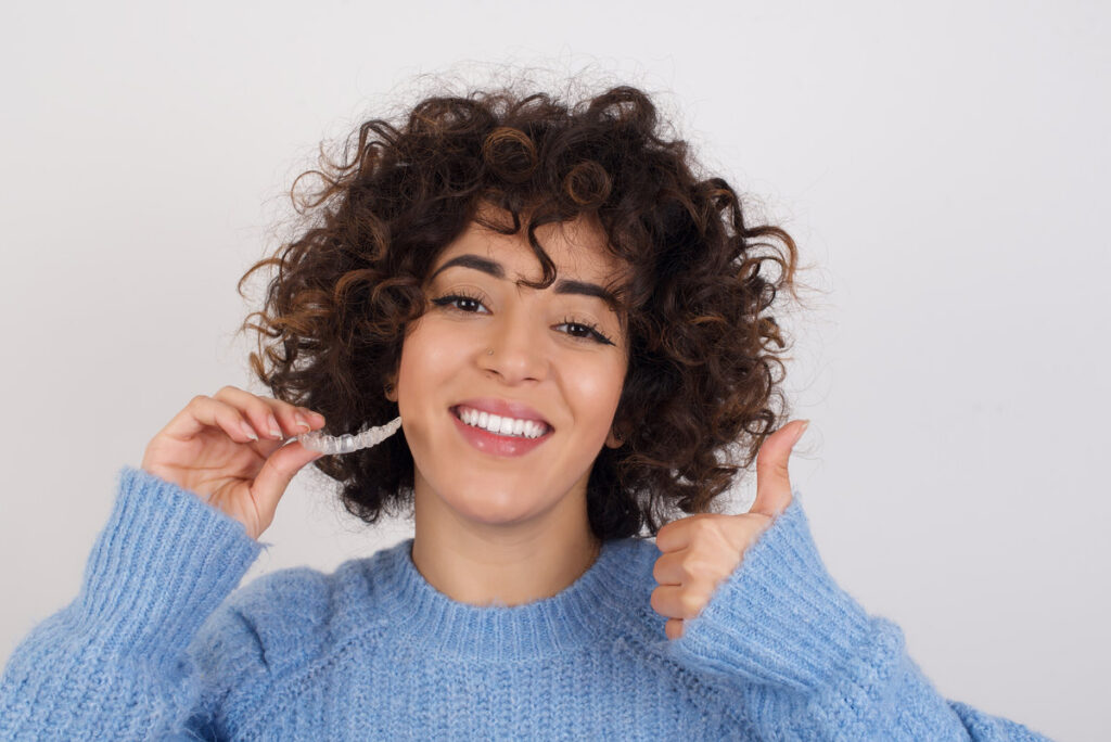 young beautiful caucasian woman wearing blue knitted sweater sta