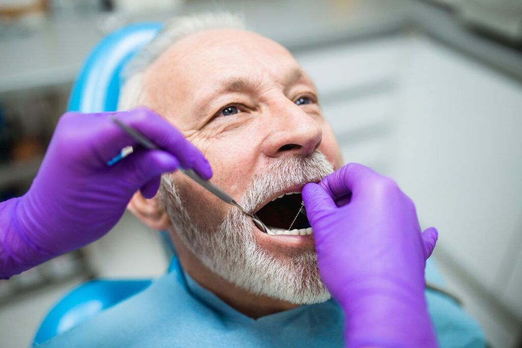 Elderly man at dental appointment