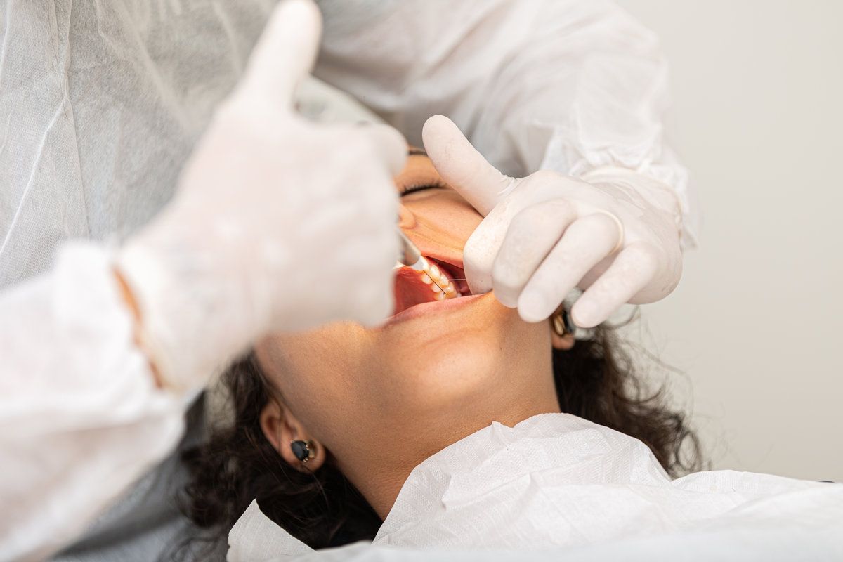 Dental examination with patient smiling