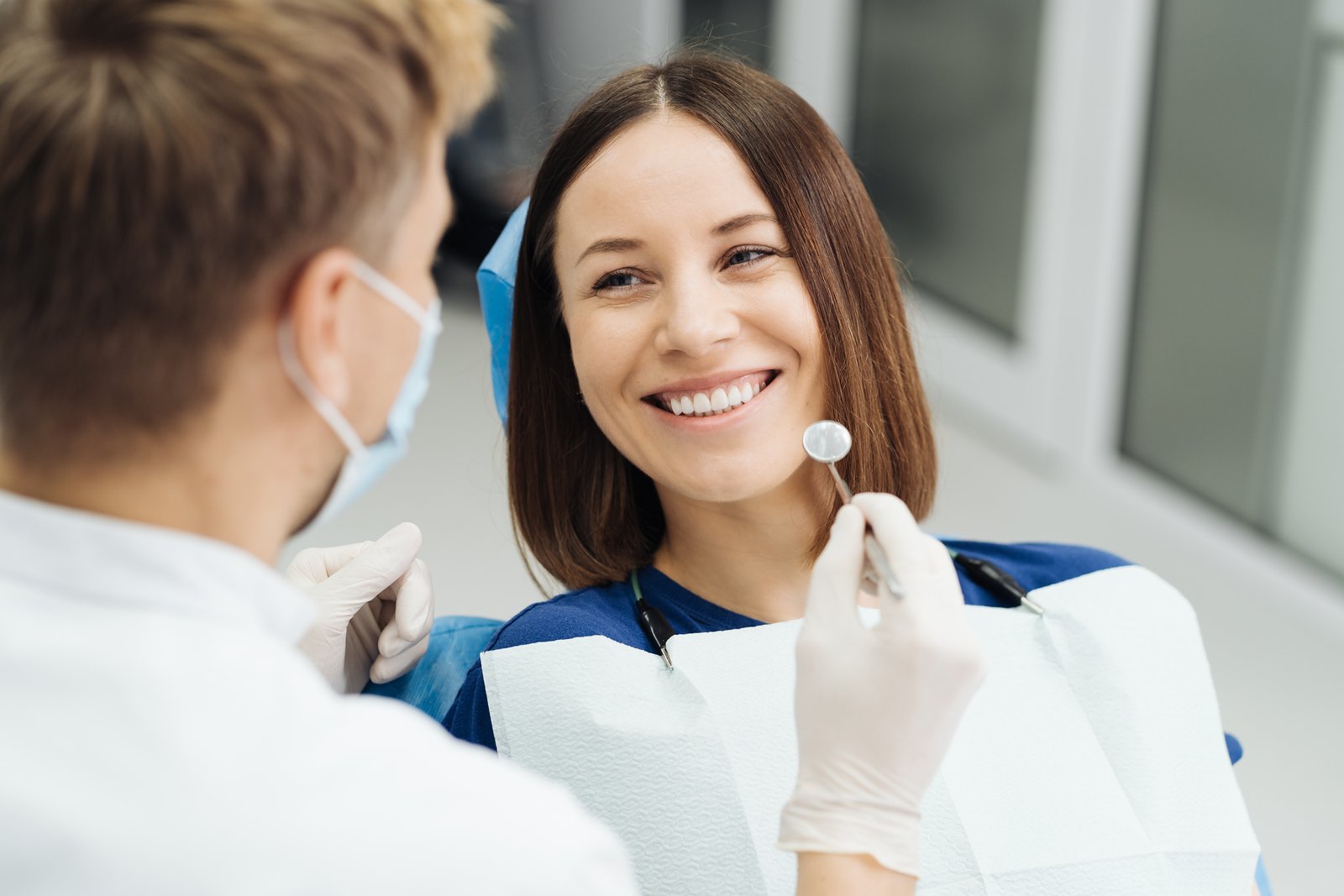 Dentist and patient discussing a cosmetic dentistry treatment plan and insurance coverage